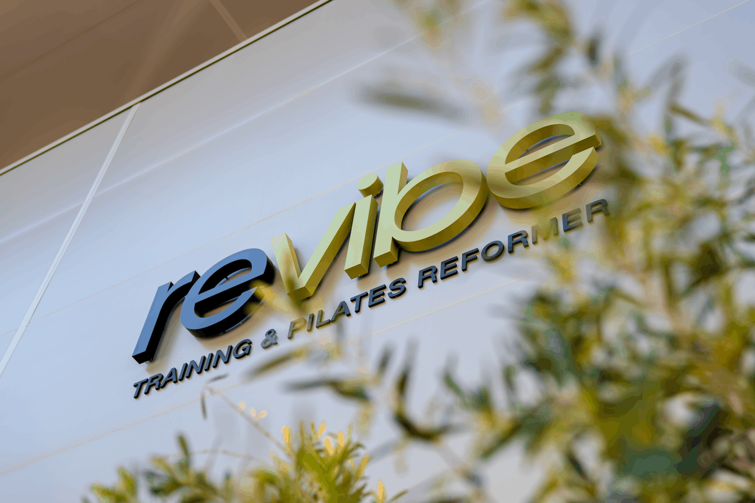 Logo exterior revibe training pilates reformer
